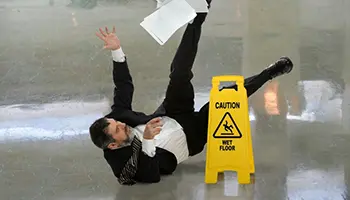 Person-Slipping-and-Falling-even-though-there-is-a-Caution-Sign copy